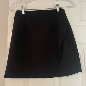 Asymmetrical black mini skirt